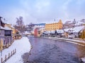 Historical houses and castle landmark statue river winter season snow in Cesky Krumlov. Czech Republic Royalty Free Stock Photo