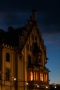 A historical luxury building. european castle by night with moody lights.