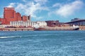 Historical Molson brewery building and a ship anchored near the old port dock on saint Lawrence river in Montreal, Quebec, Canada