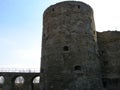 Historical monument. View of the stone walls and towers of the ancient fortress of Koporye. Russia.