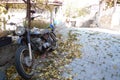 Historical motorcycle among historical village houses in Beypazari Goynukte Royalty Free Stock Photo