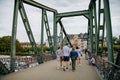 Historical pedestrian Eiserner Steg, Iron footbridge over the Main river, consists of riveted steel trusses, two bridge piers,