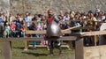 Historical reconstruction. Medieval helmet against the backdrop of a training knight.