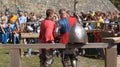 Historical reconstruction. Medieval helmet against the backdrop of a training knight.