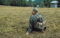 Historical reconstruction second world war. A German soldier sitting on the grass.