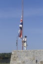 Historical reenactment of raising of flag at Fort Ticonderoga, site of French and Indian Wars, Lake Champlain, NY