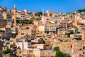 Historical rock buildings with many satellite dishes on tops in Mardin, Turkey Royalty Free Stock Photo