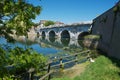 Historical roman Tiberius bridge over Marecchia river in Rimini, Italy.