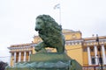 Historical sculpture of a lion in the city park. Beautiful view.