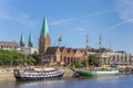 Historical ships and church along the river Weser in Bremen