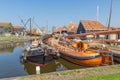 Historical fishing vessels anchored in harbor Dutch fishing village Workum