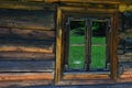 Historical small window frame on small wooden cottage from outdoor museum in Orava region, northern Slovakia