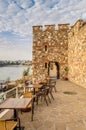 Historical southern walls and tower gate over the Black sea cove in Sozopol, Bulgaria, Europe at dusk.