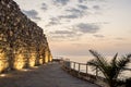 Historical southern walls over the BLack sea cove in Sozopol, Bulgaria, Europe at dusk. Royalty Free Stock Photo