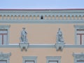 Historical statues on the wall of an old building in Tartu Royalty Free Stock Photo