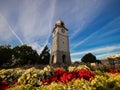 Historical stone clock tower War Memorial on Seymour Square surrounded by colourful flowers in Blenheim New Zealand Royalty Free Stock Photo