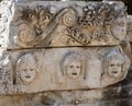 Historical Stone faces bas relief and ancient theater at Myra ancient city. Demre, Antalya, Turkey. Royalty Free Stock Photo