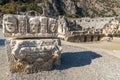 Historical Stone faces bas relief and ancient theater at Myra ancient city Royalty Free Stock Photo