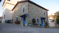 A historical stone house in GÃÂ¶kÃÂ§eada town center and a bicycle in front of it