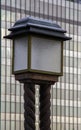 Historical street lamp against modern glass building Royalty Free Stock Photo