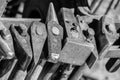 Historical tools of a blacksmith at a medieval market such as hammer, chisel, broach, chisel, beating plate, pestle, axe, pliers, Royalty Free Stock Photo