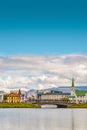 Historical and touristic downtown in Reykjavik at Summer in Iceland, cityscape at sunset at inner lake around Tjornin city park in