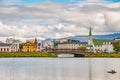 Historical and touristic downtown in Reykjavik at Summer in Iceland, cityscape at sunset at inner lake around Tjornin city park in