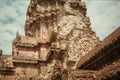 Historical tower with reliefs of the Angkor What temple, 12th century Khmer landmark. Cambodia. UNESCO Heritage Site