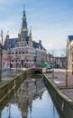 Historical town hall along a canal in Franeker Royalty Free Stock Photo