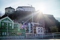 Historical town scape with Kufstein Fortress on a hillside and traditional houses, Austria.