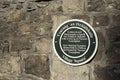 Historical home marker in Gaelic and English