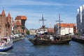 Historical vesse Lew at Stara Motlawa river, Gdansk offering tours for tourists turning around Royalty Free Stock Photo