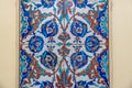 historical vibrant colorful shining floral and arabesque tiled wall with geometric decorative patterns