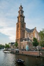 The historical Westertoren church with canal view