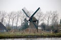 Historical windmill named Knipmolen in voorschoten along the river Vliet in the Netherlands Royalty Free Stock Photo