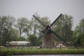 Historical windmill named Knipmolen in voorschoten along the river Vliet in the Netherlands Royalty Free Stock Photo