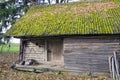 Historical wooden farm barn with moss roof Royalty Free Stock Photo