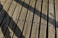 Shadow cast and wooden planks Royalty Free Stock Photo