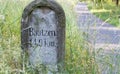 A historical signpost with kilometre indication to Bautzen. A town in Germany.