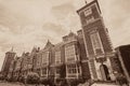 History of Architecture. Vintage toned typical historic English manor house Royalty Free Stock Photo