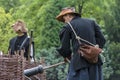 History fans dressed as 17th century mercenary soldiers load his