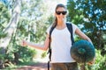 Hitch hiking woman with sleeping bag Royalty Free Stock Photo