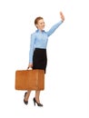 Hitch-hiking woman with suitcase Royalty Free Stock Photo