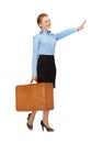 Hitch-hiking woman with suitcase Royalty Free Stock Photo