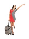 Hitch-hiking woman with suitcase Royalty Free Stock Photo