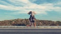 Elephant sits on luggage at highway