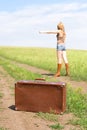 Hitchhiker with a suitcase Royalty Free Stock Photo