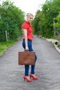 Hitchhiker with suitcase Royalty Free Stock Photo