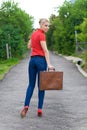 Hitchhiker with suitcase Royalty Free Stock Photo