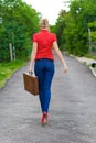 Hitchhiker with suitcase Royalty Free Stock Photo